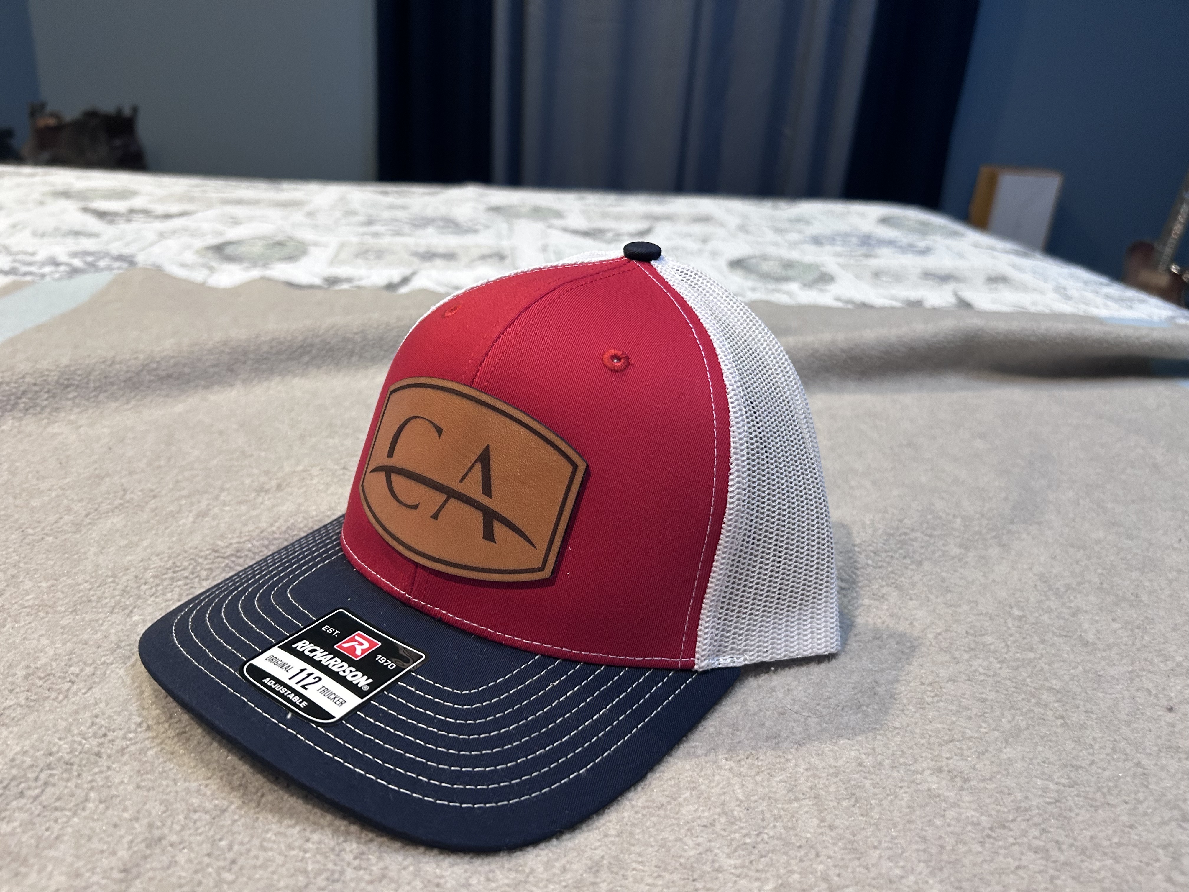CA — Richardson 112 red/white/navy · laser engraved leather patch